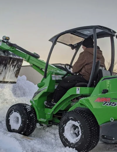 Man using a snow removal machine